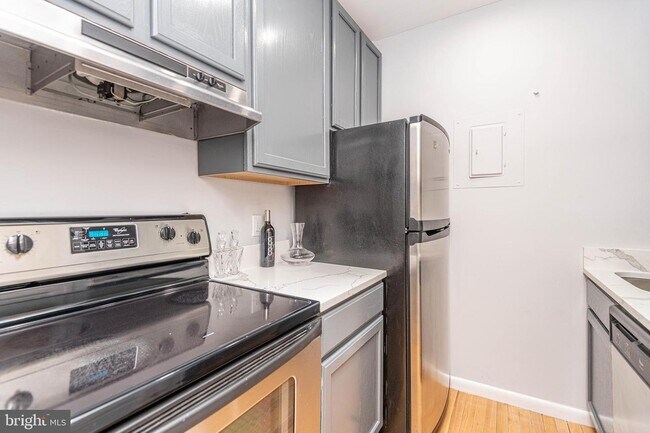 Updated kitchen with quartz countertops. - 2012 O St NW