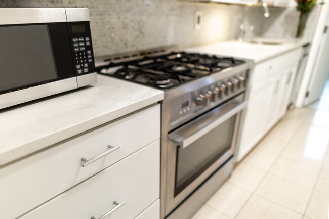 Upgraded kitchen includes new stove, counterstop, cabinets and backsplash. - 61 Duffield St