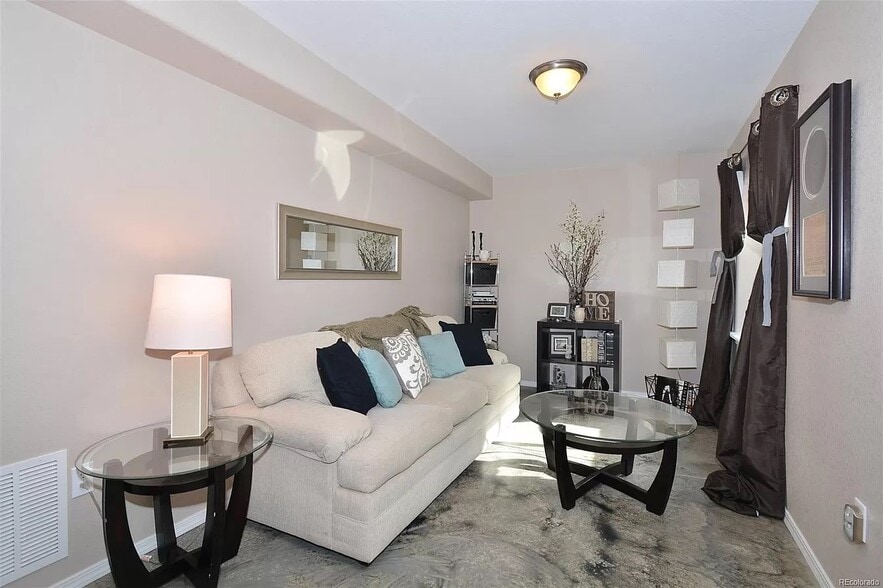 Basement seating area - 8782 Windy Plains Ct
