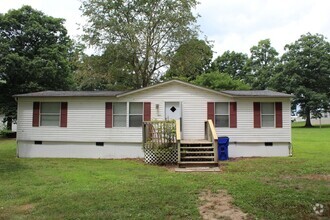 Building Photo - Four bedroom mobile home rental available now