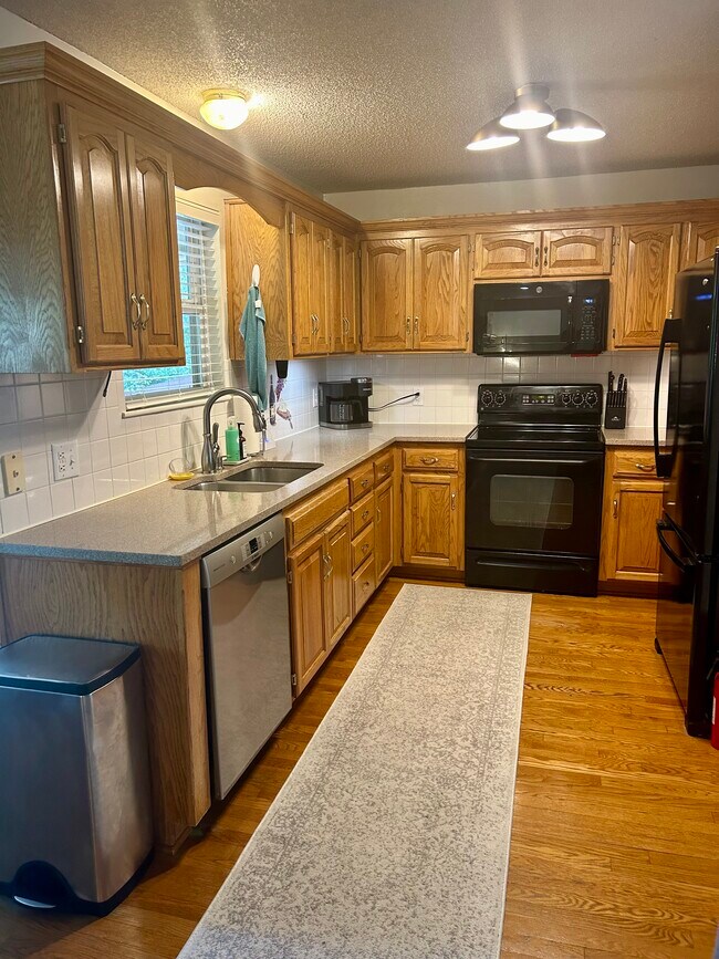 Kitchen with all necessary appliances, dishes, cooking ware, and more - 9505 NW 86th Ter