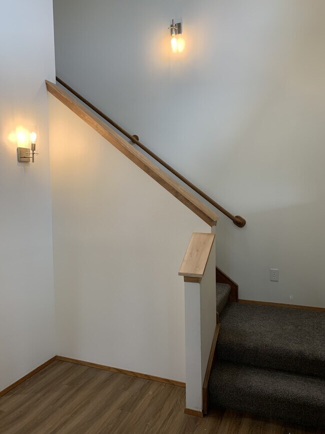 Stairs to upstairs by front door - 10615 Hillsboro Dr NW