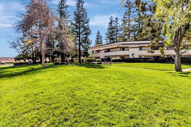 Building Photo - Stylish End-Unit Condo l Private Patio l Community Pool