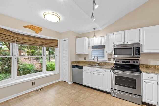 Building Photo - Spacious 4-Bedroom Carrboro Home with Dual Primary Suites & Community Amenities
