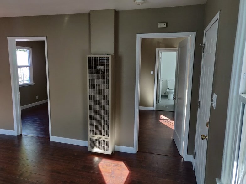 living room with furnace - 6414 10th Ave