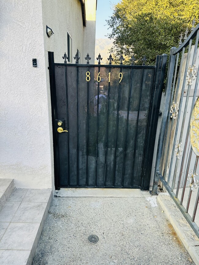 Main entrance gate - 8619 Jayseel St