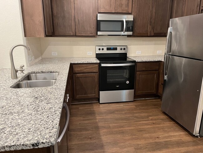 Building Photo - Move Fast! Gated Townhome Near Lackland AFB with Private Yard & EV-Ready Garage