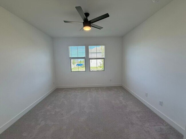 Building Photo - Move-in ready and like-new! Washer, dryer, and refrigerator Included.