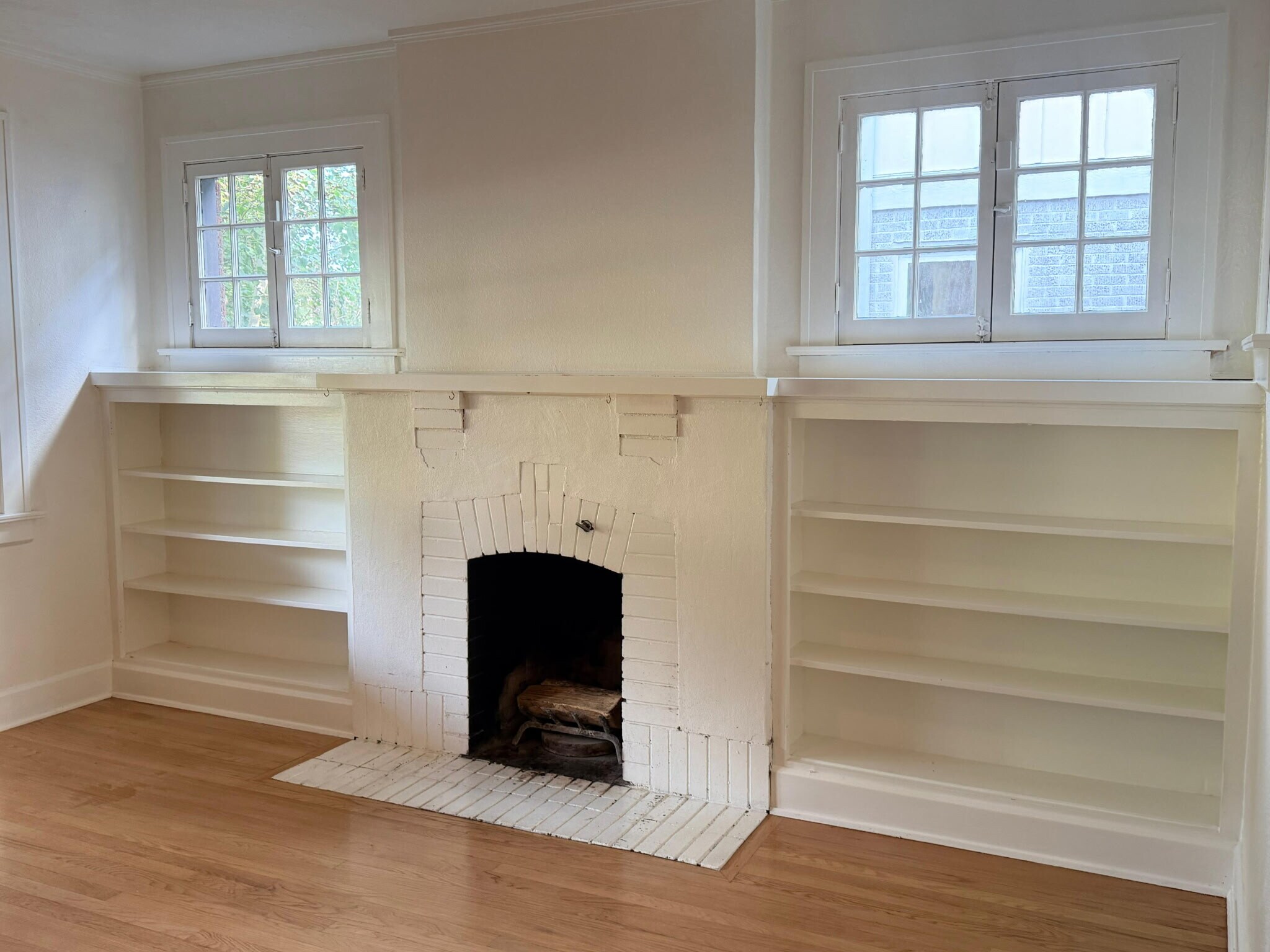Cozy living room with plenty of natural light! - 1235 S University Blvd
