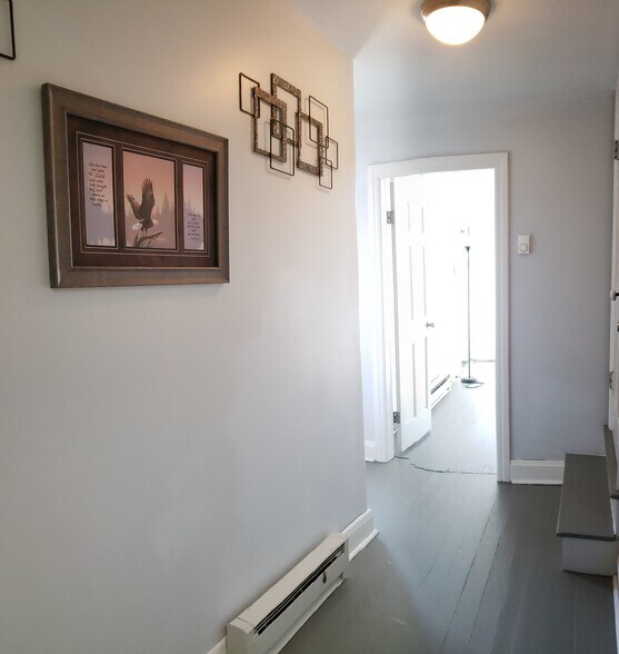 Hall to back bedroom and full bath on the left - 115 S Locust St