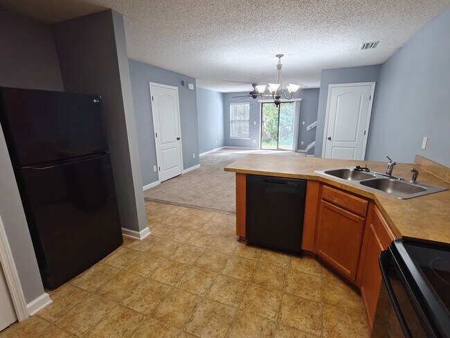 Building Photo - Spacious 2-Bed, 2.5-Bath Townhome with Gar...