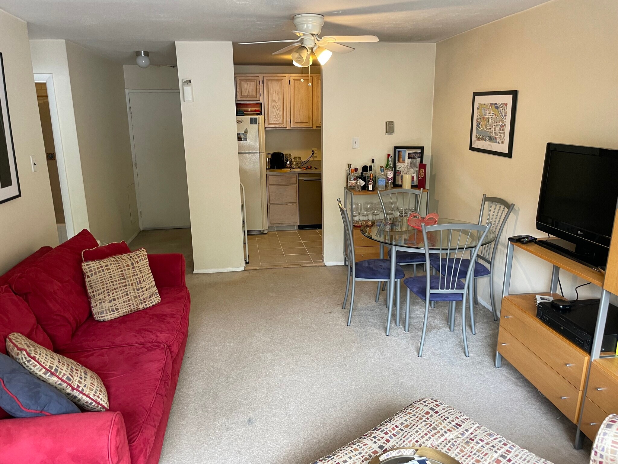 Looking at the living room, kitchen area and front entranceway... from the rear window - 4555 MacArthur Blvd NW