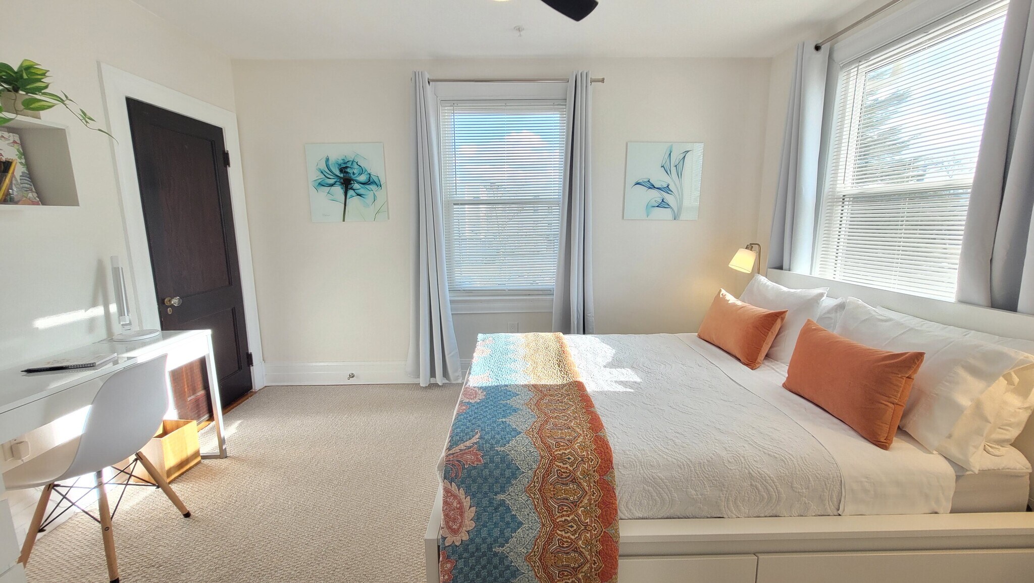 Sun filled bedroom with queen bed. - 3541 Fort Ave