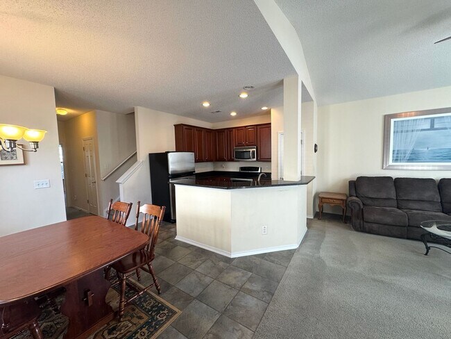 Building Photo - Relax and Unwind in this Spacious End-Unit...