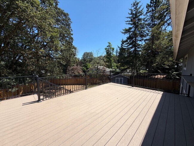 Building Photo - Spacious 4BR/3BA Home with Deck, Fenced Yard & Garage