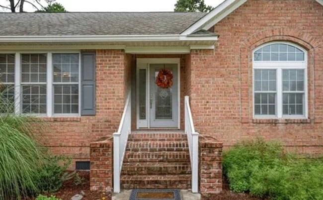 Building Photo - **Stately Brick Home in Fairfield Harbour | Tray Ceiling, Column, Bonus Room & Screened Porch**