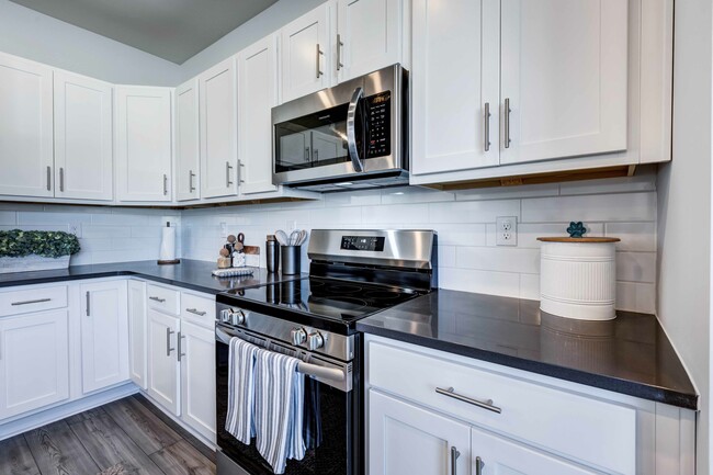 Experience the perfect blend of charm and technology in your cottage’s beautiful kitchen, equipped with smart home features, including convenient USB outlets. - Amavi Sherrills Ford