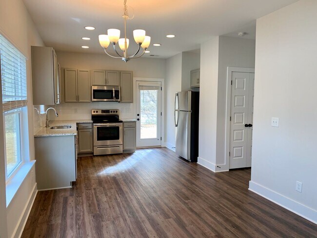 Building Photo - One level home with GARAGE and FENCED BACKYARD!