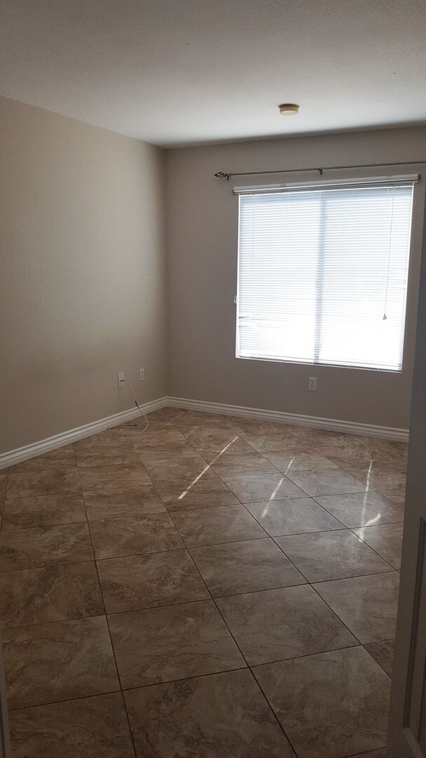 Building Photo - Three Bedroom Southwest Condo, Tile, Ground Floor
