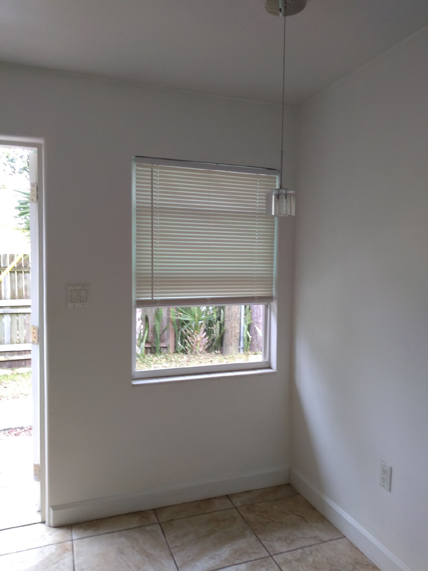 Unit 2 Kitchenette nook with tranquil view of your own fence yard - 7105 Poinsetta Ave