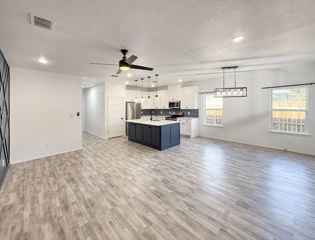 Building Photo - Modern 4-Bedroom Retreat with Patio Deck &...