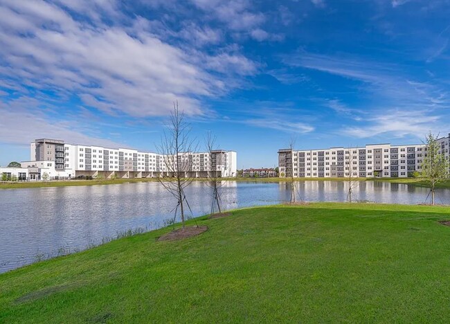 Building Photo - Top Floor Corner Unit – Brand New 3/2 Condo with Balcony in Millenia Park *** Only $1995/mo ***