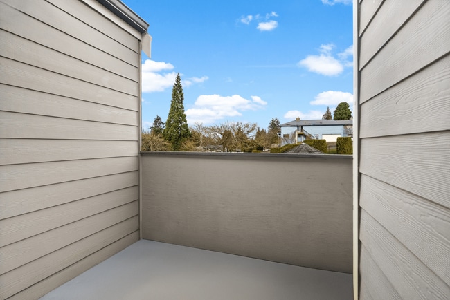 Relax on your private balcony with serene views and fresh air. - Monte Vista Apartments