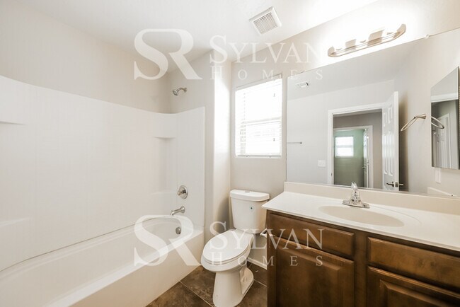 Building Photo - This home exudes a cheerful and welcoming charm!