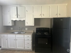 Building Photo - 2nd Floor... CORNER unit that will be perf...