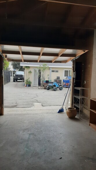 View of front house from open garage - 455 W Elk Ave