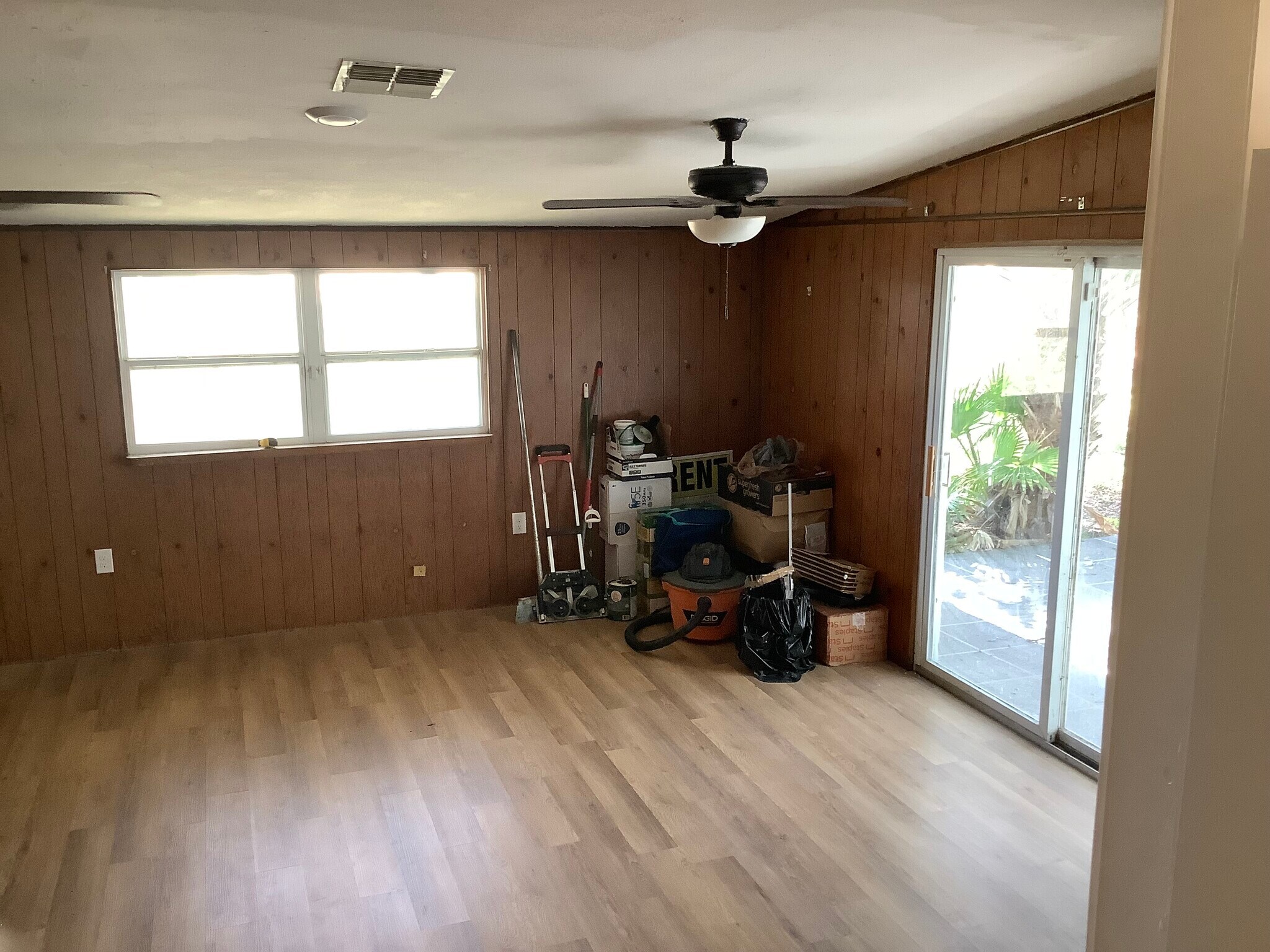 Den and entrance to the backyard patio. - 4513 Howard St