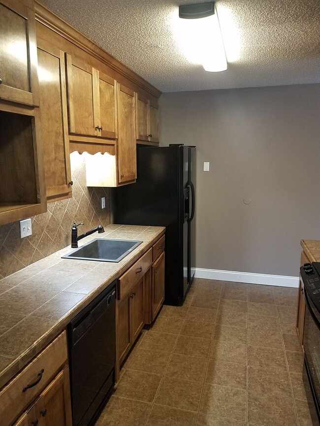 Building Photo - Spacious 3BR Brick Home with Open Split Floor Plan & Tiled Back Porch on Nearly an Acre