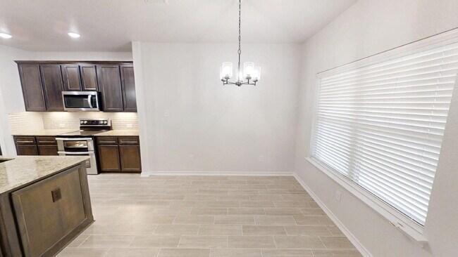 Building Photo - Welcome home to this beautifully designed 4-bedroom, 2.5-bathroom gem!