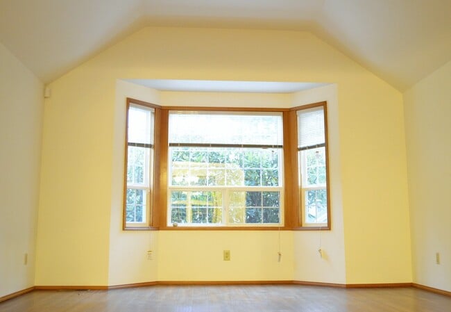 Building Photo - Private Summer Ridge Retreat with Vaulted Ceilings & Fenced Backyard