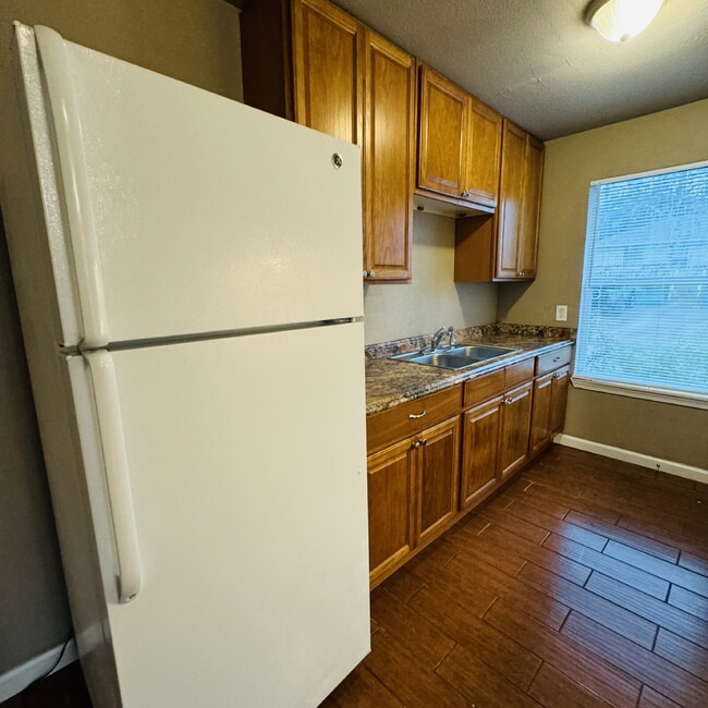 Building Photo - Welcome to Pine Shadows Duplex Apartment