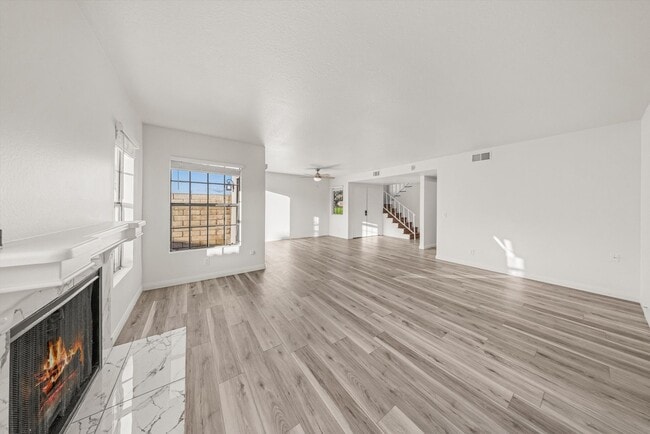 Building Photo - Large Renovated 3bed x 2.5bath Townhouse with Private Patio & 2-Car Garage