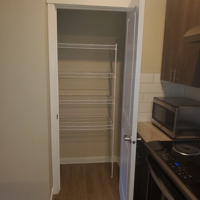 Building Photo - Stunning 1-Bedroom with Upscale Interiors & Open Island Kitchen!