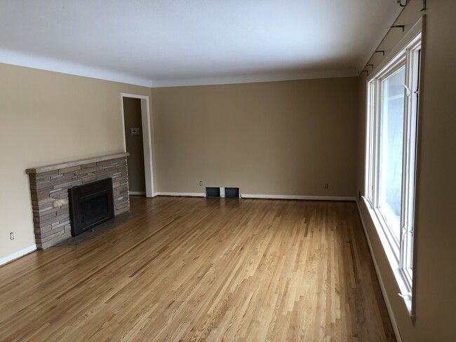 Living room. Nice wood floors. - 930 W County Rd D