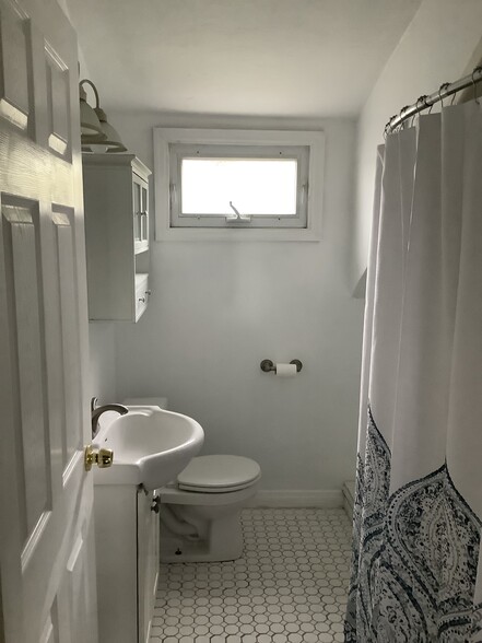 The full bathroom is also located on the second floor, convenient to all four bedrooms. - 11 Jay St