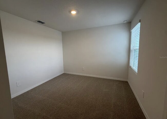 Building Photo - "Spacious 3-Bedroom Townhouse with Granite Elegance in St. Cloud – 4543 Rangeland Way"