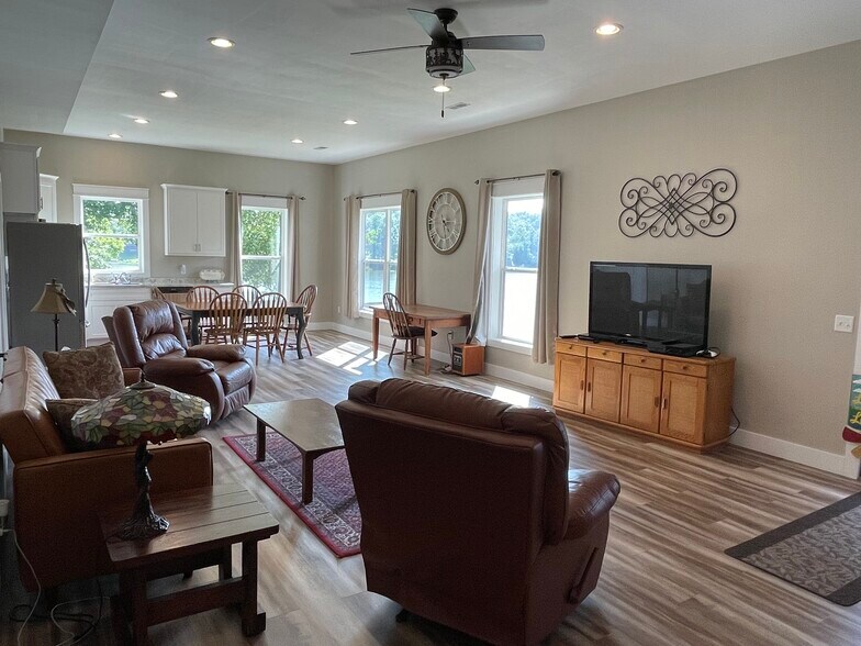 Living room with 2 recliners and a fold-down couch - 579 Bella Vista Dr