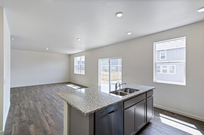 Building Photo - Spacious 4-Bedroom Wellington Home with 3-Car Garage, Loft & Fenced Backyard!