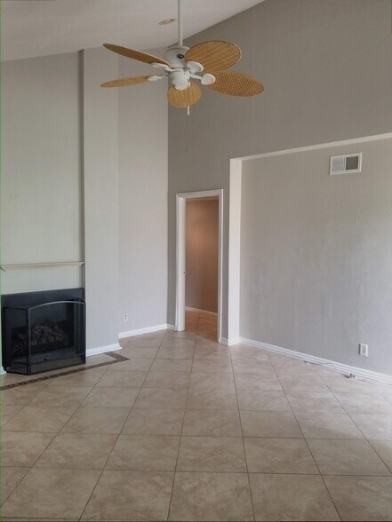 Vaulted ceiling and recess lighting in your bright living room. - 18681 Maplewood Cir