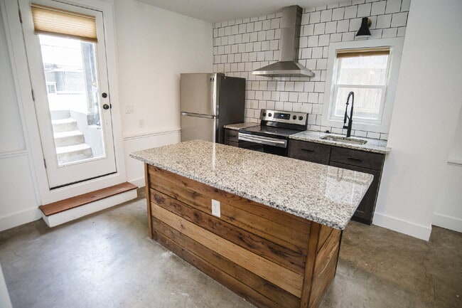 Building Photo - August Only: Submit your application this month and pay a reduced application fee of just $32.Cha...