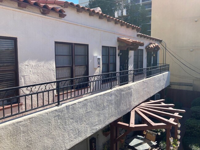 Building Photo - Spanish Garden Style Apartment Community