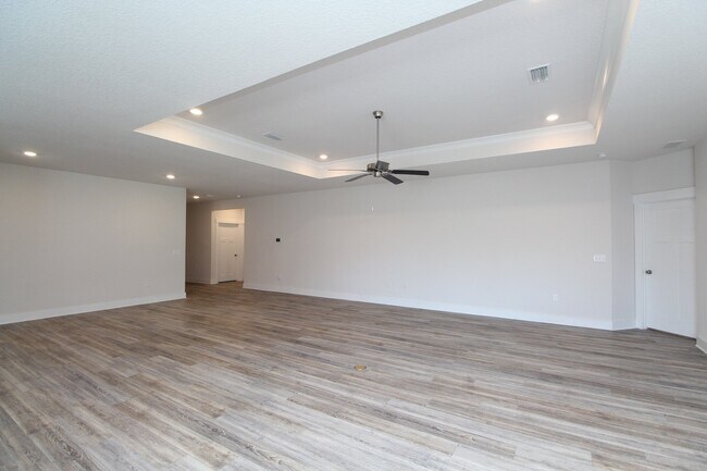 Building Photo - Don’t Miss This 4BR Home — 3-Car Garage, Modern Interior, Open Layout & Community Pool in Prime 9...
