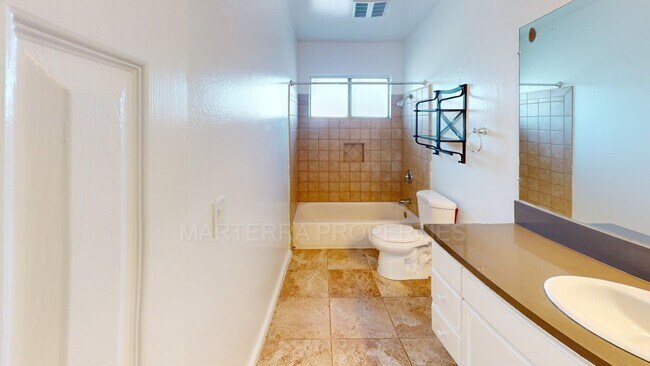 Building Photo - 2-Bed/1.5 Bath Condo with Detached Garage