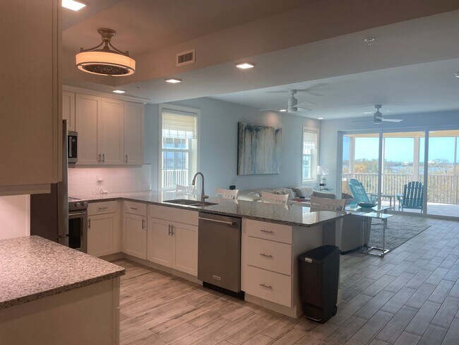 Building Photo - Coastal Luxury at Hidden Bay | 3BR Waterfront Condo with Bay Views