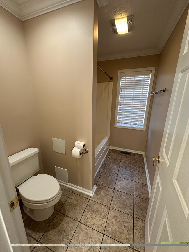 Tub/shower and toilet of Jack & Jill bath (2nd floor) - 2231 Whitney Ct