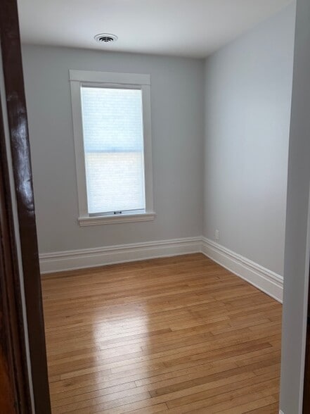 Second bedroom which is large enough for a queen-sized bed. - 623 Pierce St NE